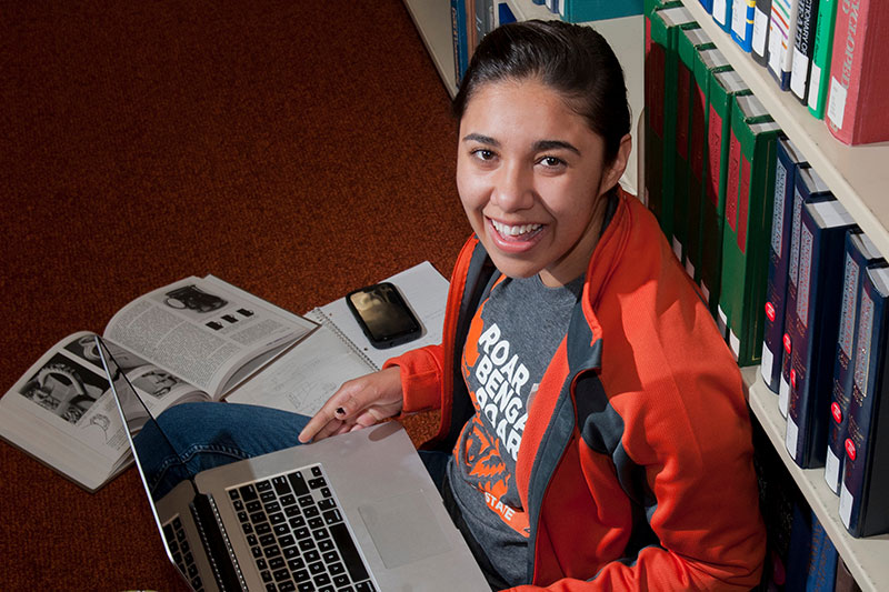 Student attending class on a laptop